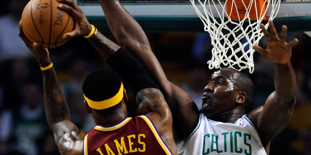 Boston Celtics center Kendrick Perkins, defends against Cleveland Cavaliers forward LeBron James during the first quarter of game three of the Eastern Conference semifinals at the TD Garden on Friday, May 07, 2010.