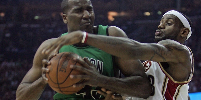 Boston Celtics center Kendrick Perkins, #43, pushes towards the net against Cleveland Cavaliers forward LeBron James, #23, as the Celtics practice before they play the Cavaliers in game 6 of the second round of the NBA finals at the Quicken Loans Arena May 16, 2008.