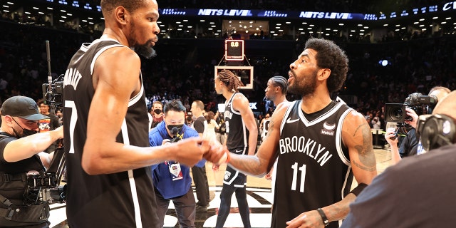 Kevin Durant and Kyrie Irving during the Brooklyn Nets-Cleveland Cavaliers game on April 12, 2022, at the Barclays Center.