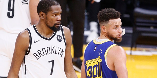 Golden State Warriors guard Stephen Curry (30) and Brooklyn Nets lead Kevin Durant (7) in the first quarter of an NBA game at Chase Center, Saturday, February 13, 2021 in San Francisco, Calif. 