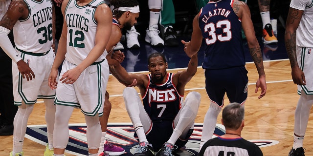 Kevin Durant, Nic Claxton, Patty Mills of Brooklyn Nets and Marcus Smart, Grant Williams of Boston Celtics in action during NBA playoffs between Brooklyn Nets and Boston Celtics at the Barclays Center in Brooklyn of New York City, United States on April 25, 2022.