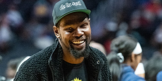 Kevin Durant is a spectator at an WNBA game between the Los Angeles Sparks and Dallas Wings.