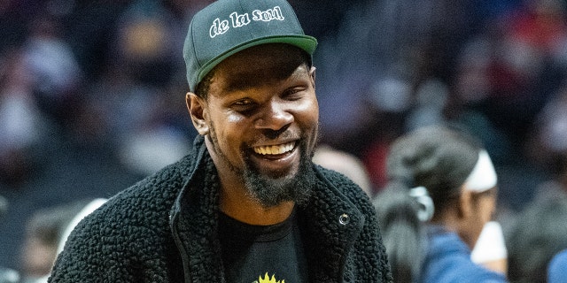 Kevin Durant is a spectator at an WNBA game between the Los Angeles Sparks and Dallas Wings.