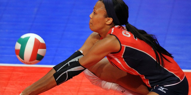 Kim Glass #10 of the USA greets players for team Brazil before the volleyball match between the USA Women's National Volleyball team and Brazil on June 14, 2008 at Clune Arena at the US Air Force Academy in Colorado Springs, Colorado