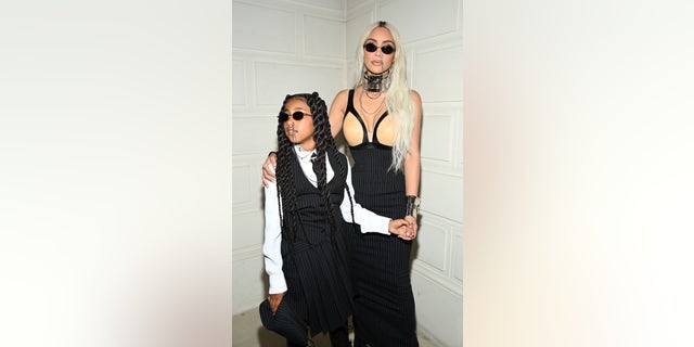 The 41-year-old billionaire matched with her eldest child as they both sported black pinstripe ensembles for the star-studded event to celebrate Olivier Rousteing's fall/winter 2022-2023 collection for the famed fashion house