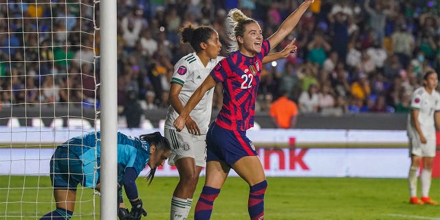 United States' Kristie Mewis (22) celebrates scoring her side's opening goal against Mexico during a CONCACAF Women's Championship soccer match in Monterrey, Mexico, Monday, July 11, 2022. 