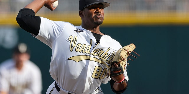 FILE - Vanderbilt pitcher Kumar Rocker, #80, throws during the first inning in Game 3 of the NCAA College World Series baseball finals on June 30, 2021, in Omaha, Neb.