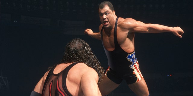 Kurt Angle fights Kane in a WWE match.