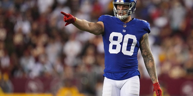 Kyle Rudolph, #80 of the New York Giants, motions against the Washington Football Team during an NFL game at FedExField on September 16, 2021 in Landover, Maryland.