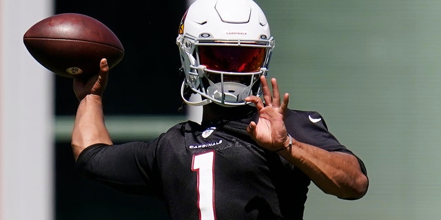 FILE - Arizona Cardinals quarterback Kyler Murray throws a pass as he attends practice at the NFL football team's practice facility on Tuesday, June 14, 2022 in Tempe, Ariz.