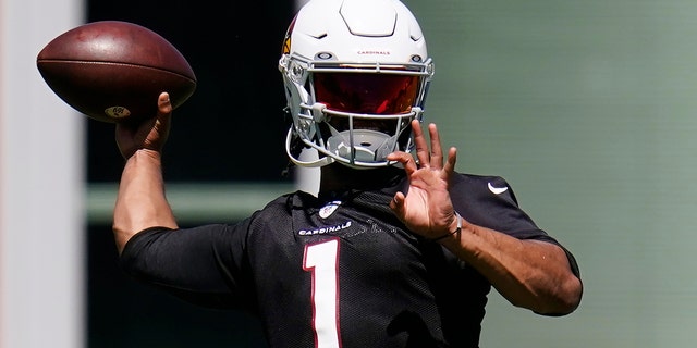 FILE - Arizona Cardinals quarterback Kyler Murray throws a pass as he takes part in drills at the NFL football team's practice facility Tuesday, June 14, 2022, in Tempe, Ariz.