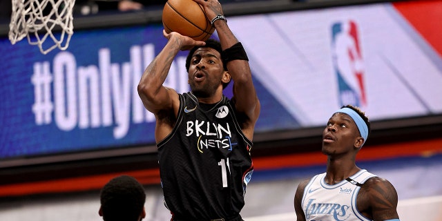 Kyrie Irving of the Brooklyn Nets takes a shot against the Los Angeles Lakes at Barclays Center on April 10, 2021, in New York City.