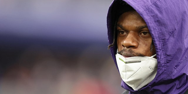 Lamar Jackson of the Baltimore Ravens on the sideline in the third quarter of a game against the Los Angeles Rams at M and T Bank Stadium Jan. 2, 2022, in Baltimore.