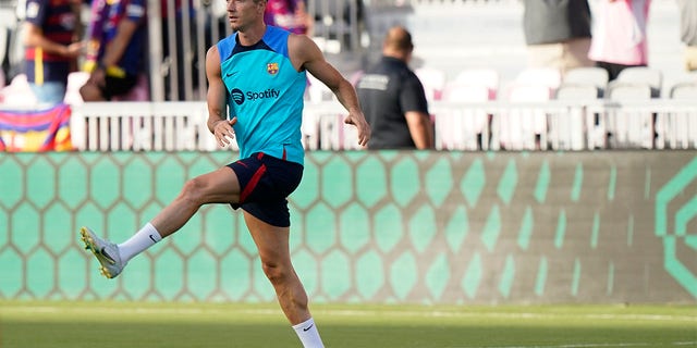 FC Barcelona's Robert Lewandowski warms up Tuesday, July 19, 2022, before the team's friendly soccer match against Inter Miami in Fort Lauderdale, Fla. 