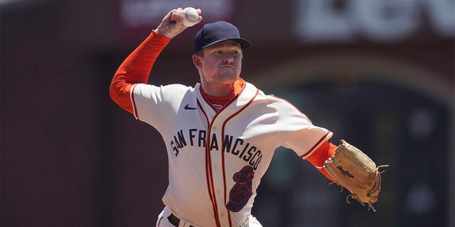 San Francisco Giants' Logan Webb pitches against the Milwaukee Brewers during the first inning of a baseball game in San Francisco, Sunday, July 17, 2022. The Giants are wearing San Francisco Sea Lions jerseys to honor African American Heritage Day. 