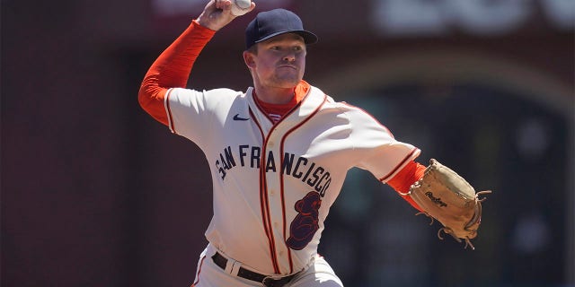 San Francisco Giants' Logan Webb pitches against the Milwaukee Brewers during the first inning of a baseball game in San Francisco, Sunday, July 17, 2022. The Giants are wearing San Francisco Sea Lions jerseys to honor African American Heritage Day.