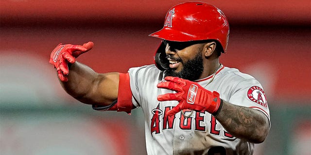 Los Angeles Angels' Luis Rengifo celebrates on second aftar hitting a two-run double during the seventh inning of a baseball game against the Kansas City Royals Tuesday, July 26, 2022, in Kansas City, Mo. 