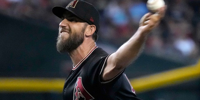 Arizona Diamondbacks starting pitcher Madison Bumgarner throws against the Washington Nationals in the first inning at Chase Field in Phoenix, Ariz., July 23, 2022.