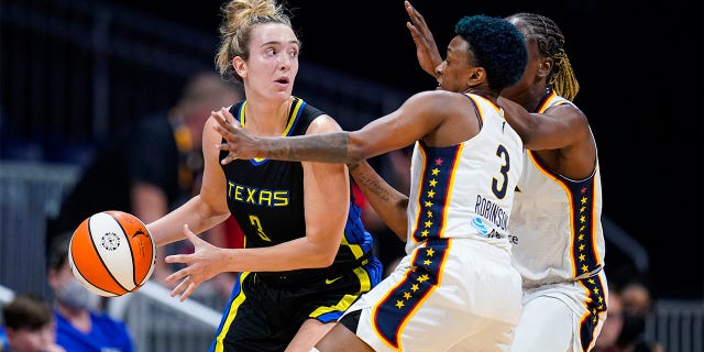 Dallas Wings guard Marina Mabre (3) defends by Indiana Fever guard Danielle Robinson (3) during the first half of a WNBA basketball game in Indianapolis, Sunday, July 24, 2022. 