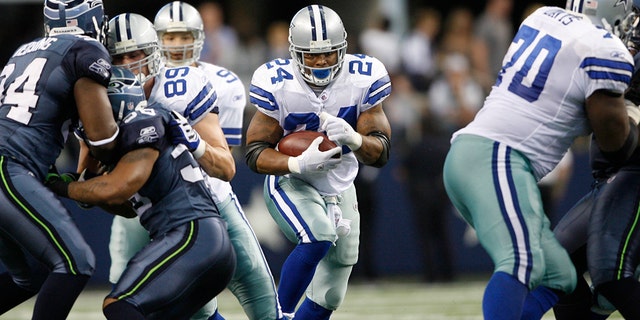 Dallas Cowboys running back Marion Barber, #24, runs the football against the Seahawks during game between the Seattle Seahawks and the Dallas Cowboys.