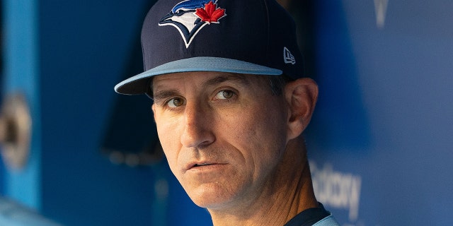 Blue Jays first base coach Mark Budzinski in the dugout before the Oakland Athletics game at Rogers Centre in Toronto on Sept. 3, 2021.