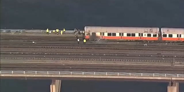 A Massachusetts Bay Transportation Authority Orange Line train caught fire and passengers evacuated, July 21, 2022.