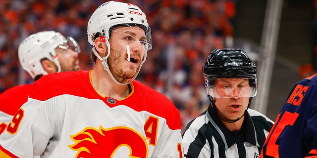 Calgary Flames right wing Matthew Tkachuk gets pulled from a scrum during a game against the Edmonton Oilers in the second round of the Stanley Cup playoffs May 24, 2022, at Rogers Place in Edmonton.