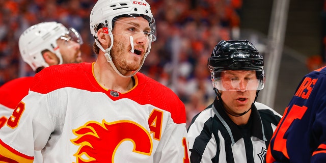 Calgary Flames Right Wing Matthew Tkachuk (19) gets pulled out of scrum action in the first period during the Edmonton Oilers versus the Calgary Flames in the Stanley Cup playoffs round 2, game 4 on May 24, 2022 at Rogers Place in Edmonton, AB.