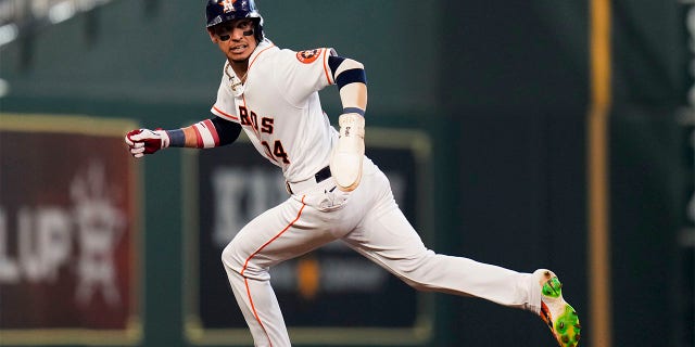 Houston Astros' Mauricio Dubon runs to third after a failed pickoff-attempt of Dubon at first by Kansas City Royals starting pitcher Jonathan Heasley during the fifth inning of a baseball game, Monday, July 4, 2022, in Houston.