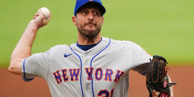 New York Mets starting pitcher Max Scherzer works the first inning of a baseball game against the Atlanta Braves, Monday, July 11, 2022, in Atlanta.
