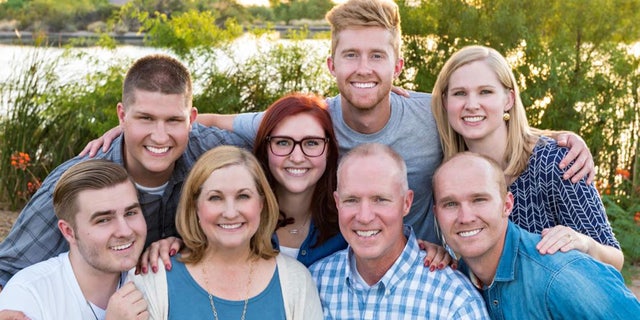 Melanie Shaha and her family before losing her hair to radiation. 