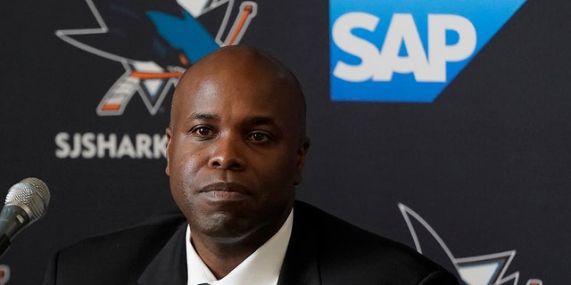 Mike Grier listens to questions as he is introduced as the new general manager of the San Jose Sharks at a news conference in San Jose, Calif., Tuesday, July 5, 2022. 
