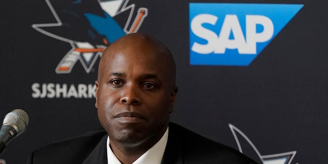 Mike Grier listens to questions as he is introduced as the new general manager of the San Jose Sharks at a news conference in San Jose, Calif., Tuesday, July 5, 2022. 