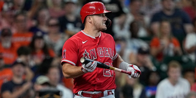 Los Angeles Angels' Mike Trout reacts after striking against the Houston Astros during the third inning of a baseball game in Houston, Sunday, July 3, 2022. 