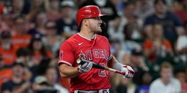 Los Angeles Angels' Mike Trout reacts after striking out against the Houston Astros during the third inning of a baseball game Sunday, July 3, 2022, in Houston. 