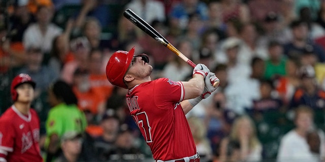 Los Angeles Angels' Mike Trout pops out against the Houston Astros during the seventh inning of a baseball game Sunday, July 3, 2022, in Houston.