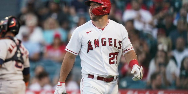 Los Angeles Angels' Mike Trout walks toward the dugout after striking out against the Houston Astros on July 12, 2022, in Anaheim, California.