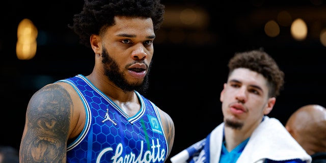 Miles Bridges #0 of the Charlotte Hornets is restrained after being ejected from the game during the second half against the Atlanta Hawks at State Farm Arena on April 13, 2022 in Atlanta, Georgia.