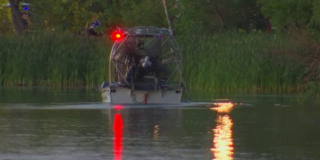 Emergency personnel searched Vadnais Lake in Minnesota where officials feared a triple homicide had taken place.