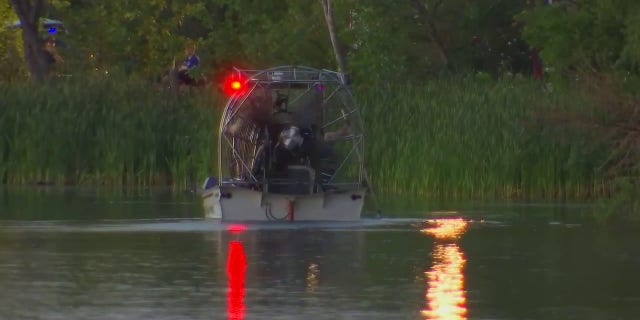 Emergency personnel searched Vadnais Lake in Minnesota where officials feared a triple homicide had taken place.