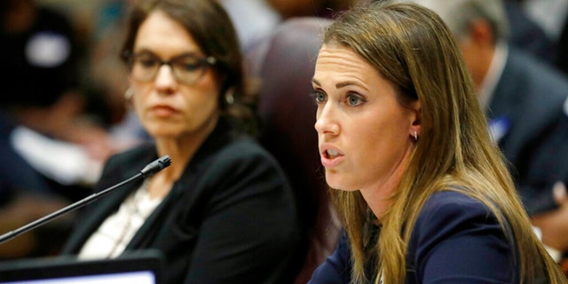 FILE: Paula Vanderford, chief accountability officer for the Mississippi Department of Education, left, listens to Erin Meyer, a special attorney general assigned to the department, in Jackson, Miss.