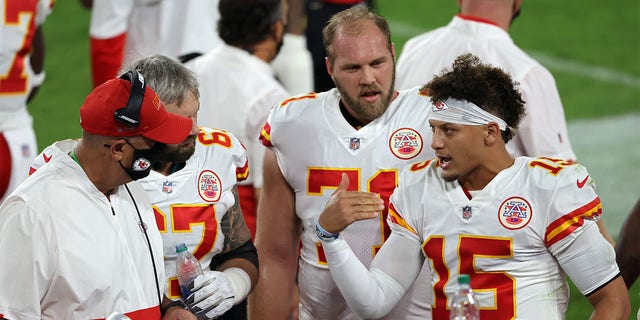 Patrick Mahomes (15) of the Kansas City Chiefs talks with Daniel Kilgore (67) and Mitchell Schwartz (71) during a game against the Baltimore Ravens on September 28, 2020 at M&T Bank Stadium in Baltimore.