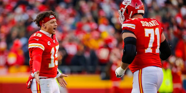 Patrick Mahomes (15) of the Kansas City Chiefs congratulates Mitchell Schwartz (71) after scoring a first quarter touchdown in the AFC Championship Game against the Tennessee Titans at Arrowhead Stadium January 19, 2020 in Kansas City, Mo. 
