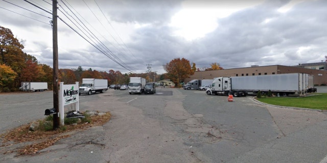 A Mojitos Country Club sign and parking lot in Randolph, Massachusetts