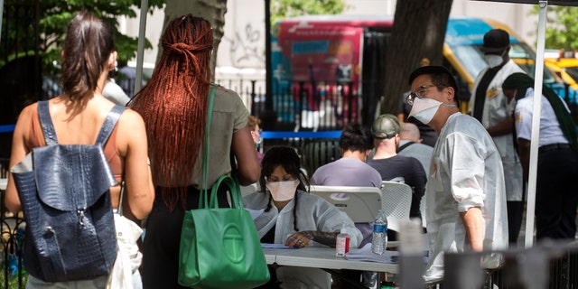 People wait to be vaccinated at a monkeypox vaccination site in New York, USA on July 14, 2022.  The U.S. is ramping up testing and delivery of a vaccine to control the monkeypox outbreak as more than 1,000 confirmed cases have been reported nationwide. 