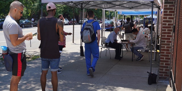 NEW YORK CITY, US - JULY 14: People wait in line for monkey pox vaccination after Monkey pox appointment website in New York City crashed on due to overwhelming traffic, local sources said on Thursday, July 14. Local authorities announced that the number of cases is increasing across the country, including in New York City.