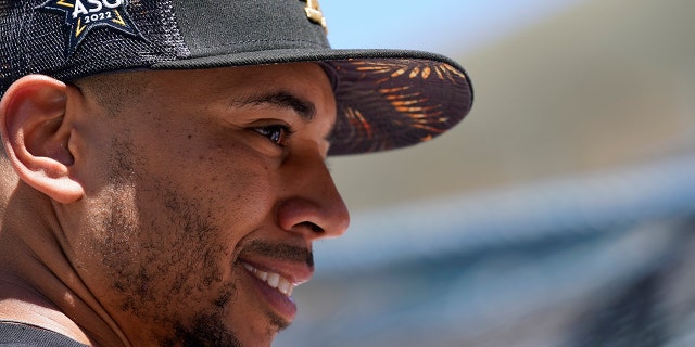 National League outfielder Mookie Betts, of the Los Angeles Dodgers, looks on during batting practice prior to the MLB All-Star baseball game, Tuesday, July 19, 2022, in Los Angeles.