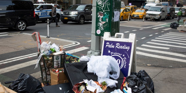 Piles of uncollected garbage overflow on Seventh Avenue on November 11, 2021 in midtown, New York City.