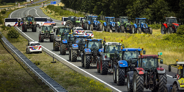 Farmers, on July 4, take part in a blockade of the A67 near Eindhoven to protest against government plans that may require them to use less fertilizer and reduce livestock.