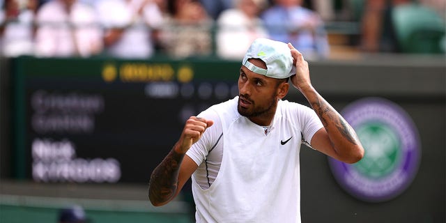 Nick Kyrgios of Australia celebrates winning a match against Cristian Garin of Chile during their men's singles quarterfinal match at Wimbledon 2022 at the All England Lawn Tennis and Croquet Club on July 6, 2022, in London. 